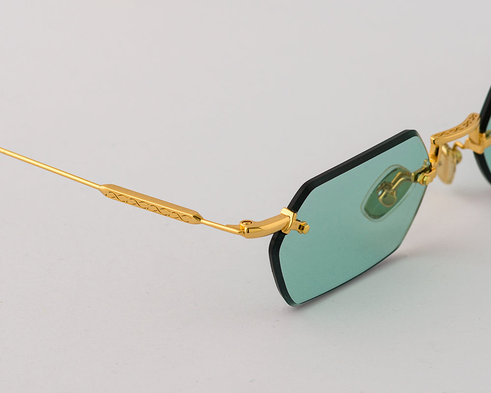 Eyepetizer Tank C.4-48 hexagonal sunglasses for women in rimless steel, with gold frame, and aqua green lenses. 52mm in lens size, 18mm in bridge size, and 145mm in temple length.