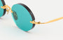 Eyepetizer Wilmot C.4-56 oval sunglasses for women in rimless steel, with gold frame, and aqua green lenses. 54mm in lens size, 18mm in bridge size, and 145mm in temple length.