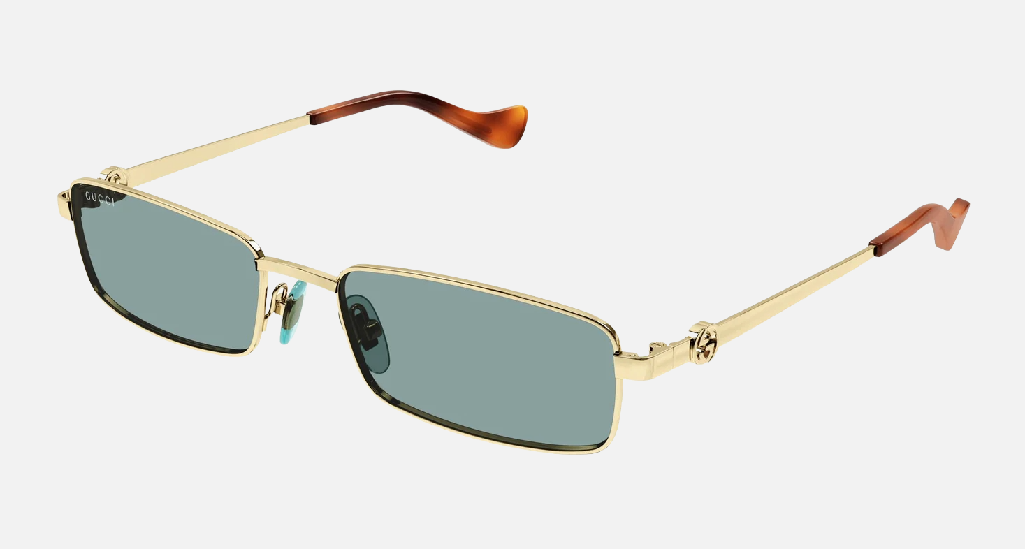 Gucci GG1600S 003 women's full rim rectangle sunglasses in a gold metal frame with green lenses. Features a 56 mm lens size, 18 mm bridge size, and 140 mm temple length. Available in Dubai, UAE.