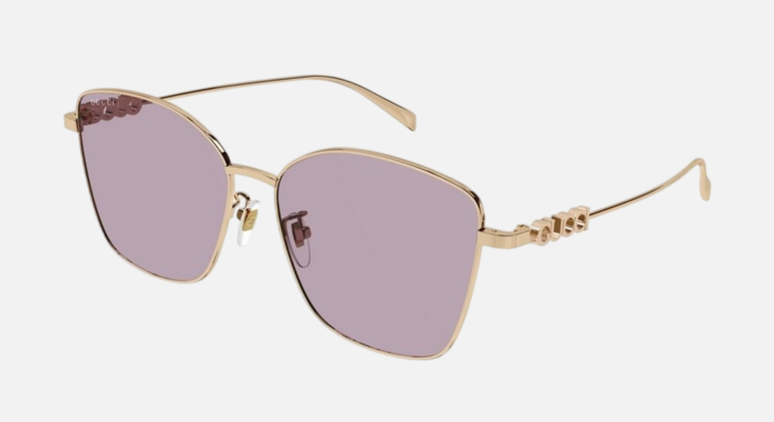 Gucci GG1805SA 003 cat eye sunglasses for women in full rim metal, with gold frame, and violet lenses. 60mm in lens size, 15mm in bridge size, and 145mm in temple length.