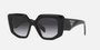 Prada PR 14ZS 1AB09S irregular sunglasses for women in full rim acetate, with black frame, and grey gradient lenses. 50mm in lens size, 18mm in bridge size, and 140mm in temple length.