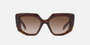 Prada PR 14ZS 2AU6S1 irregular sunglasses for women in full rim acetate, with havana frame, and brown gradient lenses. 50mm in lens size, 18mm in bridge size, and 140mm in temple length.