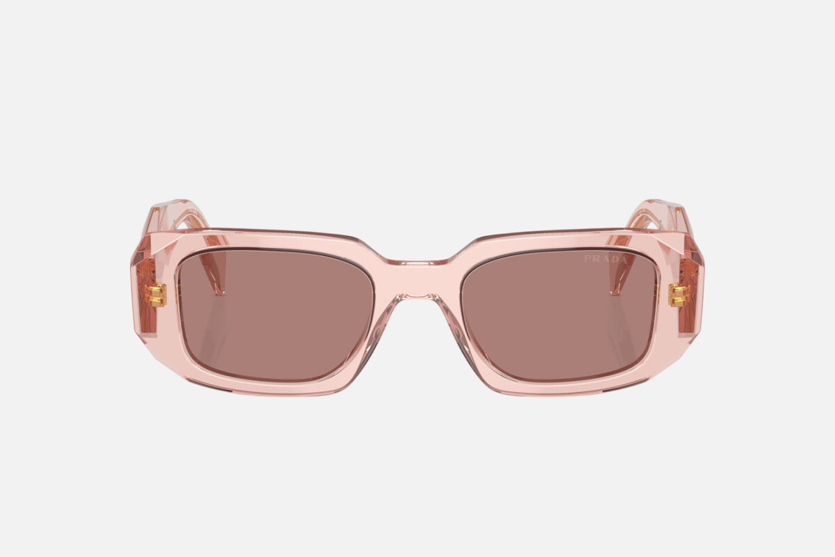 Prada PR 17WS 19Q10D rectangular sunglasses for women in full rim acetate, with transparent peach frame, and light brown lenses. 49mm in lens size, 20mm in bridge size, and 145mm in temple length.