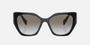 Prada PR 19ZS 1AB0A7 cat eye sunglasses for women in full rim acetate, with black frame, and grey gradient lenses. 55mm in lens size, 17mm in bridge size, and 145mm in temple length.