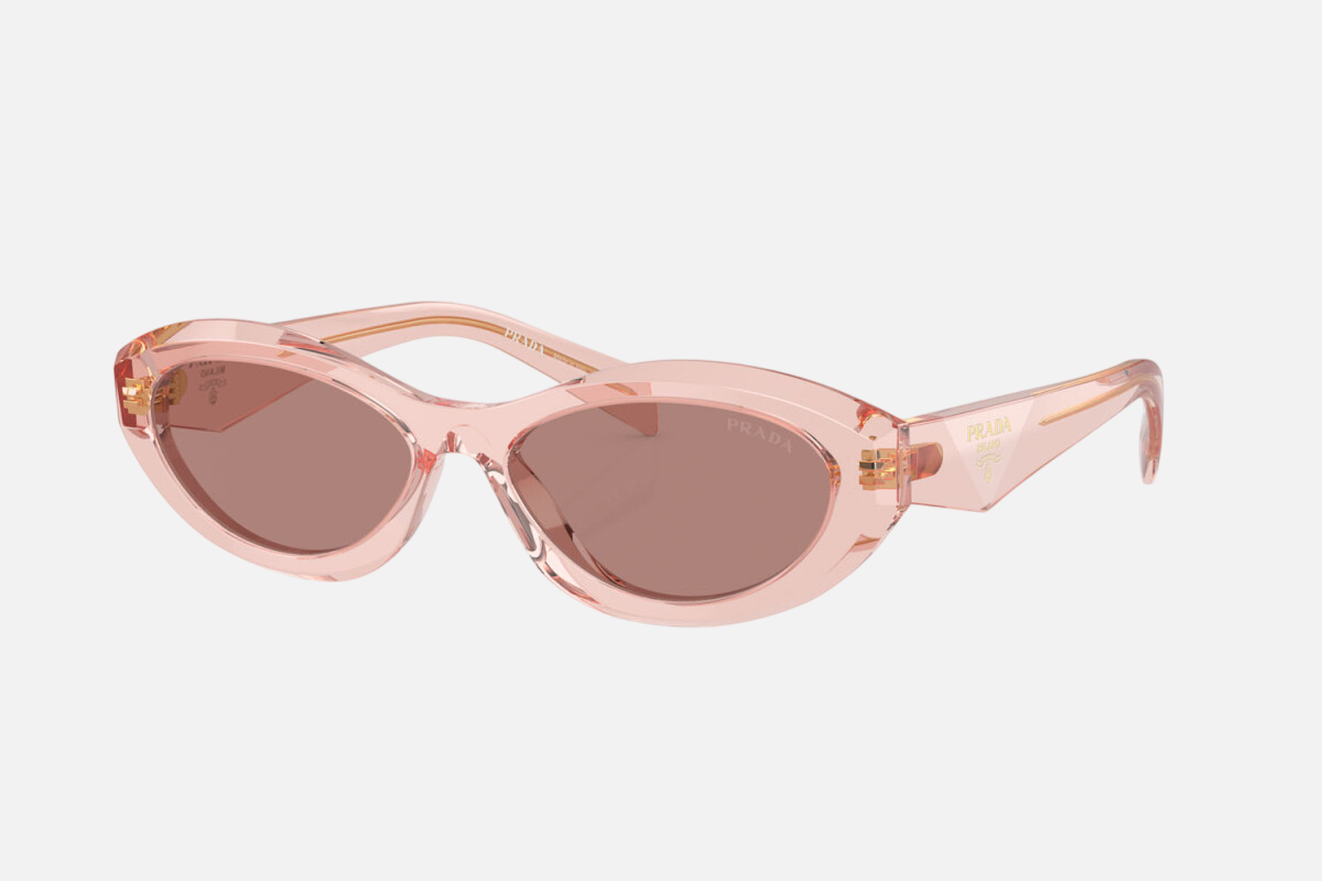 Prada PR 26ZS 19Q10D oval sunglasses for women in full rim acetate, with transparent peach frame, and light brown lenses. 55mm in lens size, 16mm in bridge size, and 145mm in temple length.