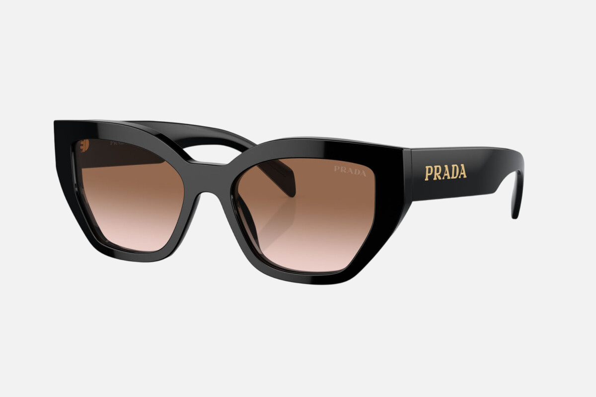Prada PR A09S 1AB0A6 cat eye sunglasses for women in full rim acetate, with black frame, and brown gradient lenses. 53mm in lens size, 18mm in bridge size, and 145mm in temple length.