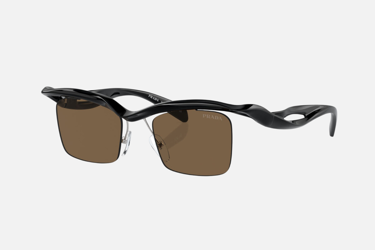 Prada PR A15S 1AB8C1 rectangular sunglasses for men in rimless nylon, with black frame, and dark brown lenses. 47mm in lens size, 20mm in bridge size, and 135mm in temple length.