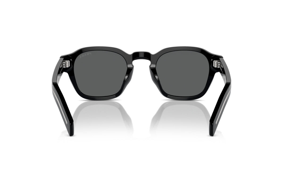 Prada PR A16S 16K731 round sunglasses for men in full rim acetate, with black frame, and dark grey lenses. 49mm in lens size, 24mm in bridge size, and 145mm in temple length.