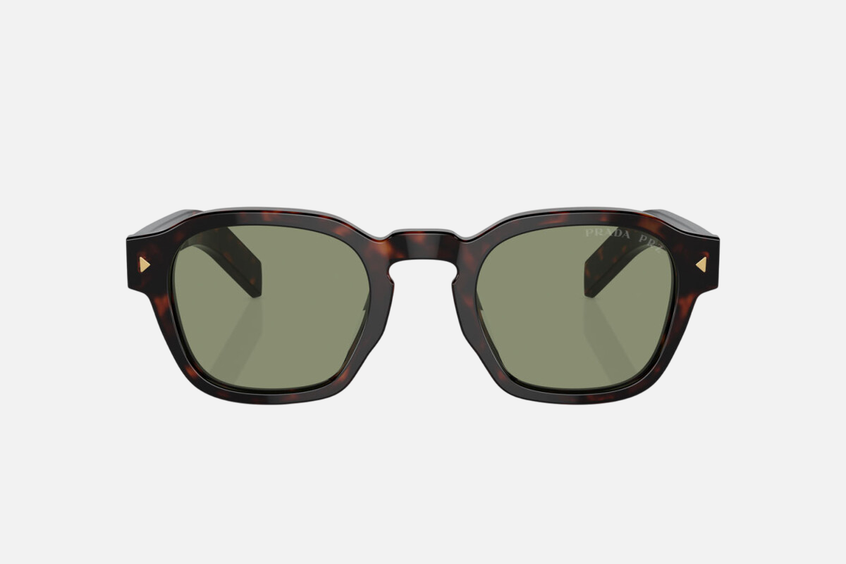 Prada PR A16S 17N20G round sunglasses for men in full rim acetate, with havana frame, and green lenses. 49mm in lens size, 24mm in bridge size, and 145mm in temple length.