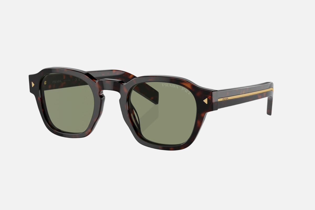 Prada PR A16S 17N20G round sunglasses for men in full rim acetate, with havana frame, and green lenses. 49mm in lens size, 24mm in bridge size, and 145mm in temple length.